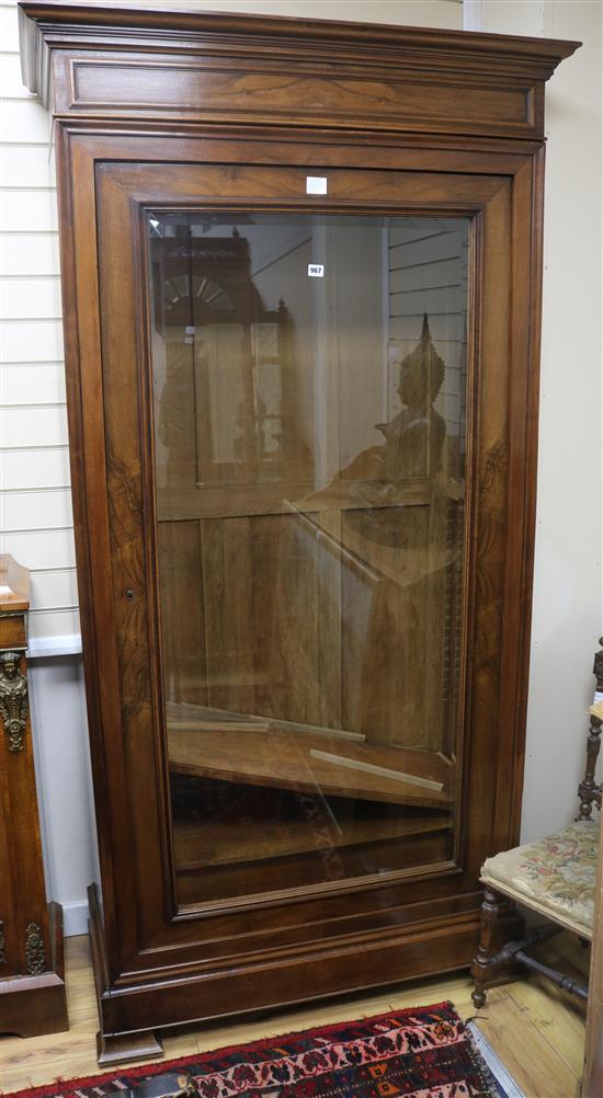 A mid 19th century French walnut bookcase, enclosed by a single plate glass door W.111cm